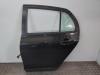 Toyota Yaris Model SCP90L Bj.2007 Tür hinten Links 209 Black- Night Sky Black